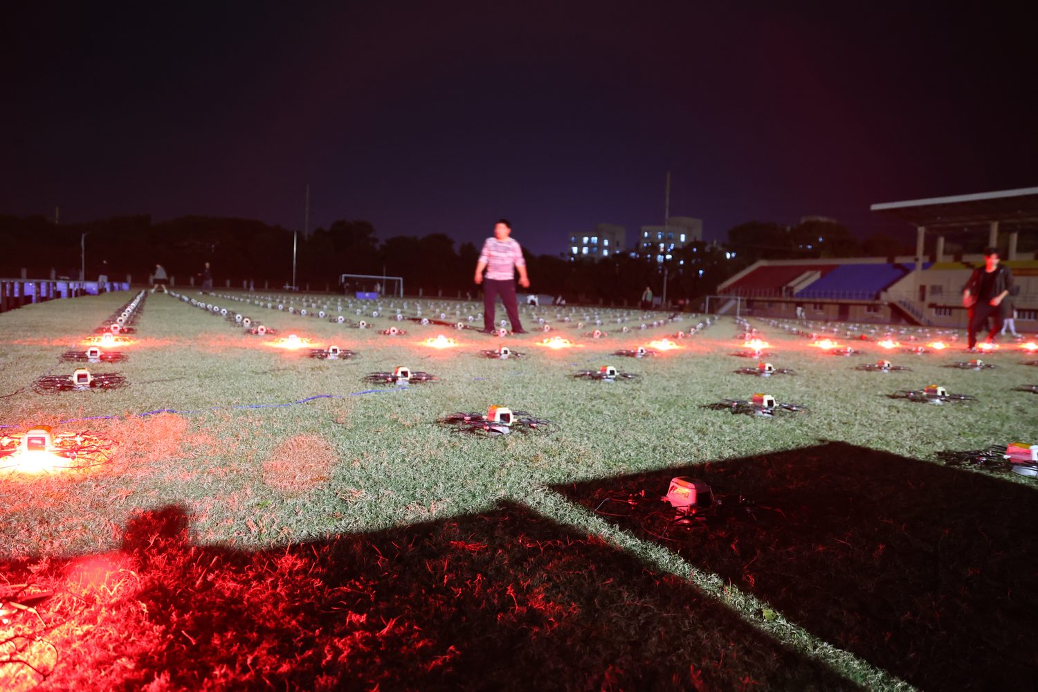 Red LED ground test with show drones on field